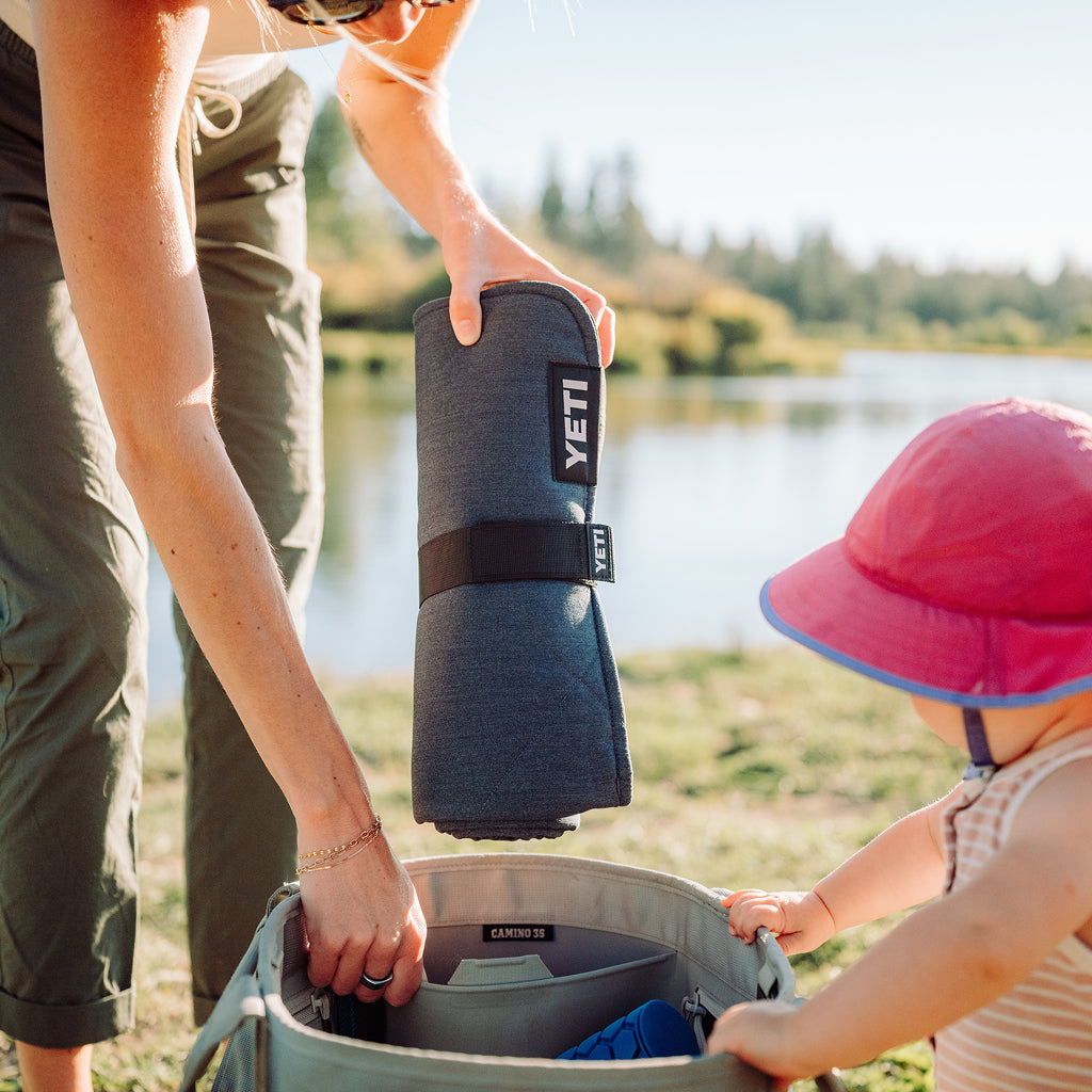 YETI Small Lowlands Blanket rolled up in a strap.